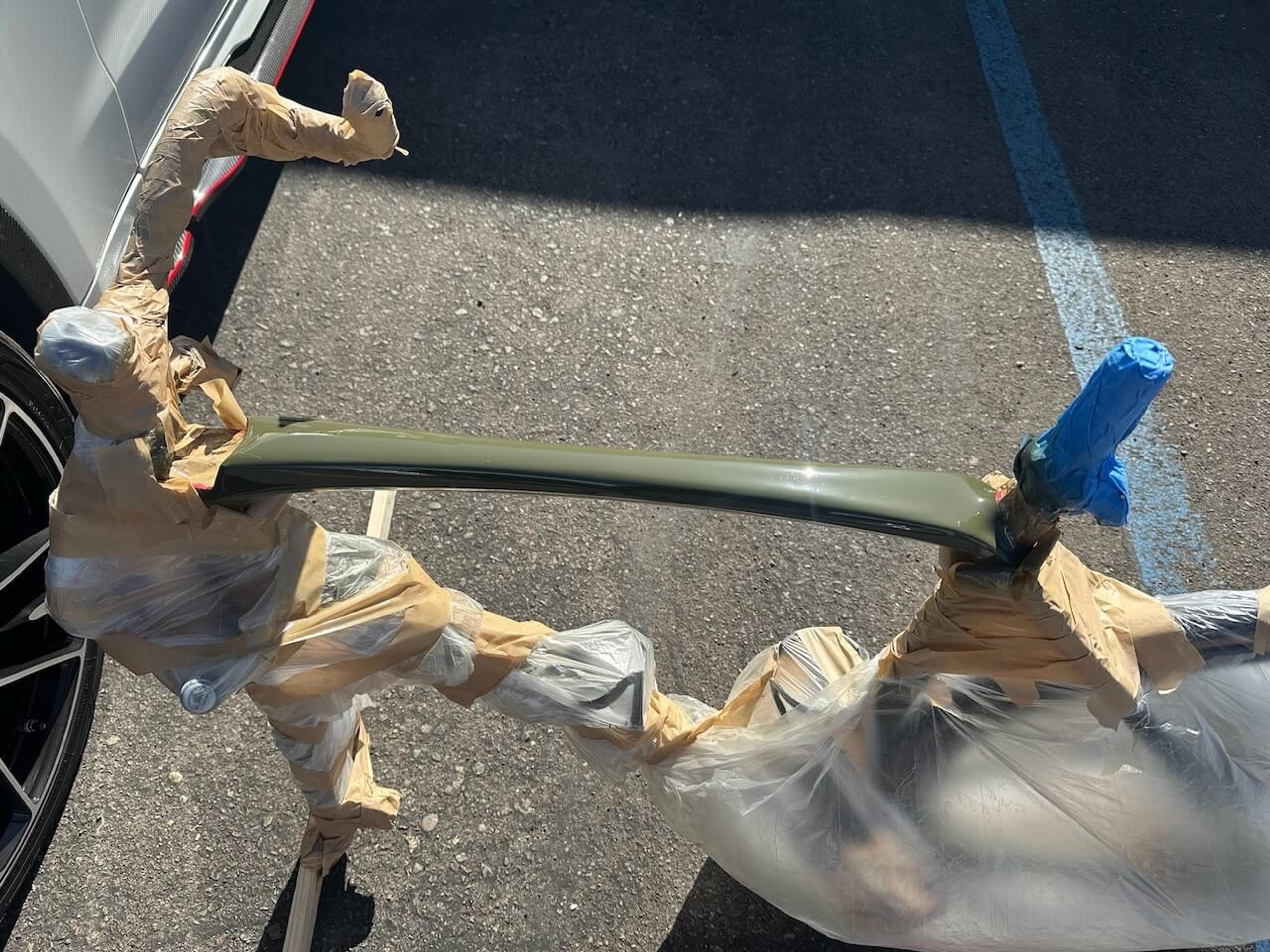 Trek Émonda SL frame masked around the repaired top tube during the refinishing process