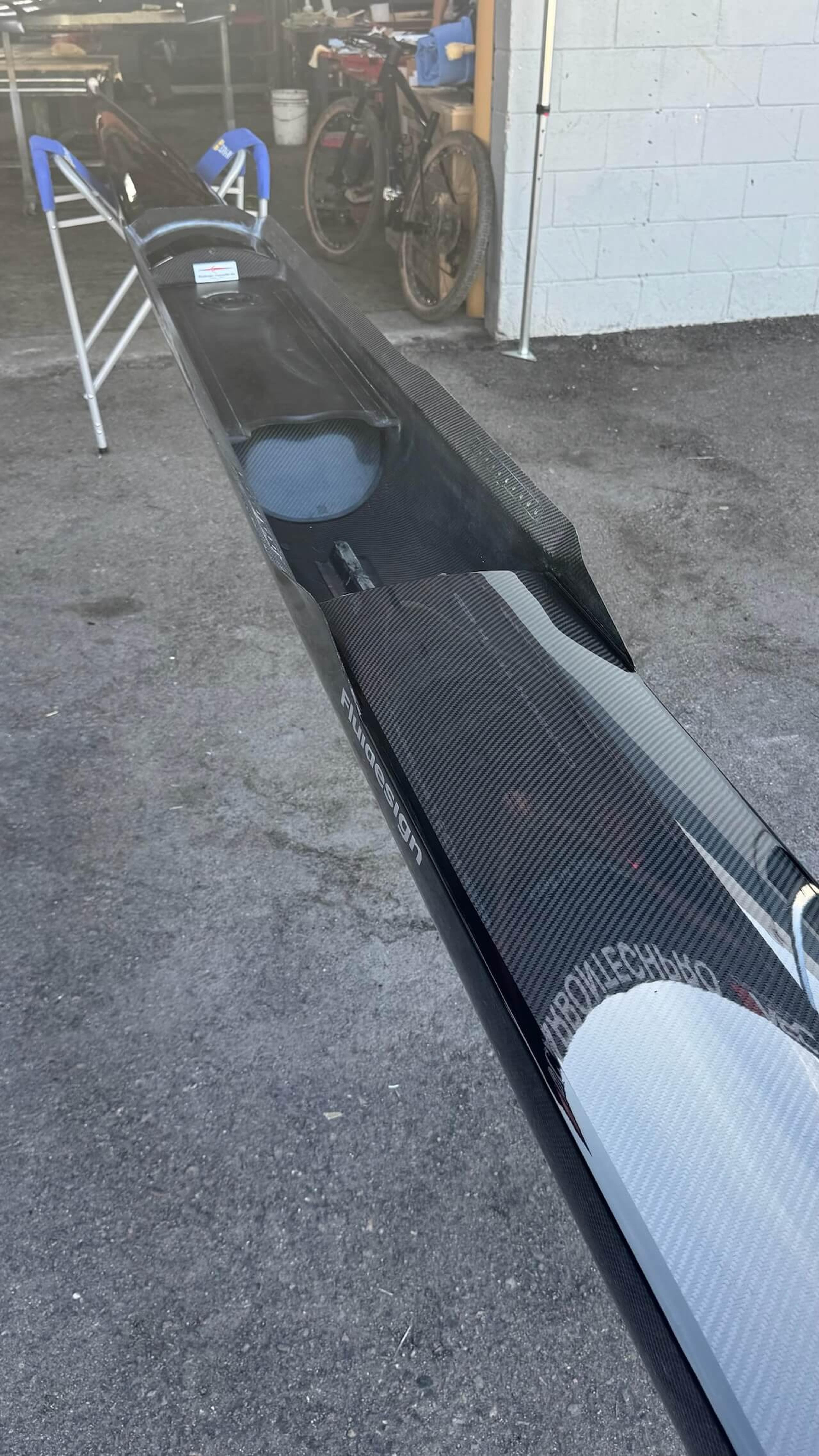 Interior view of a Fluidesign carbon fiber rowing shell after repair work