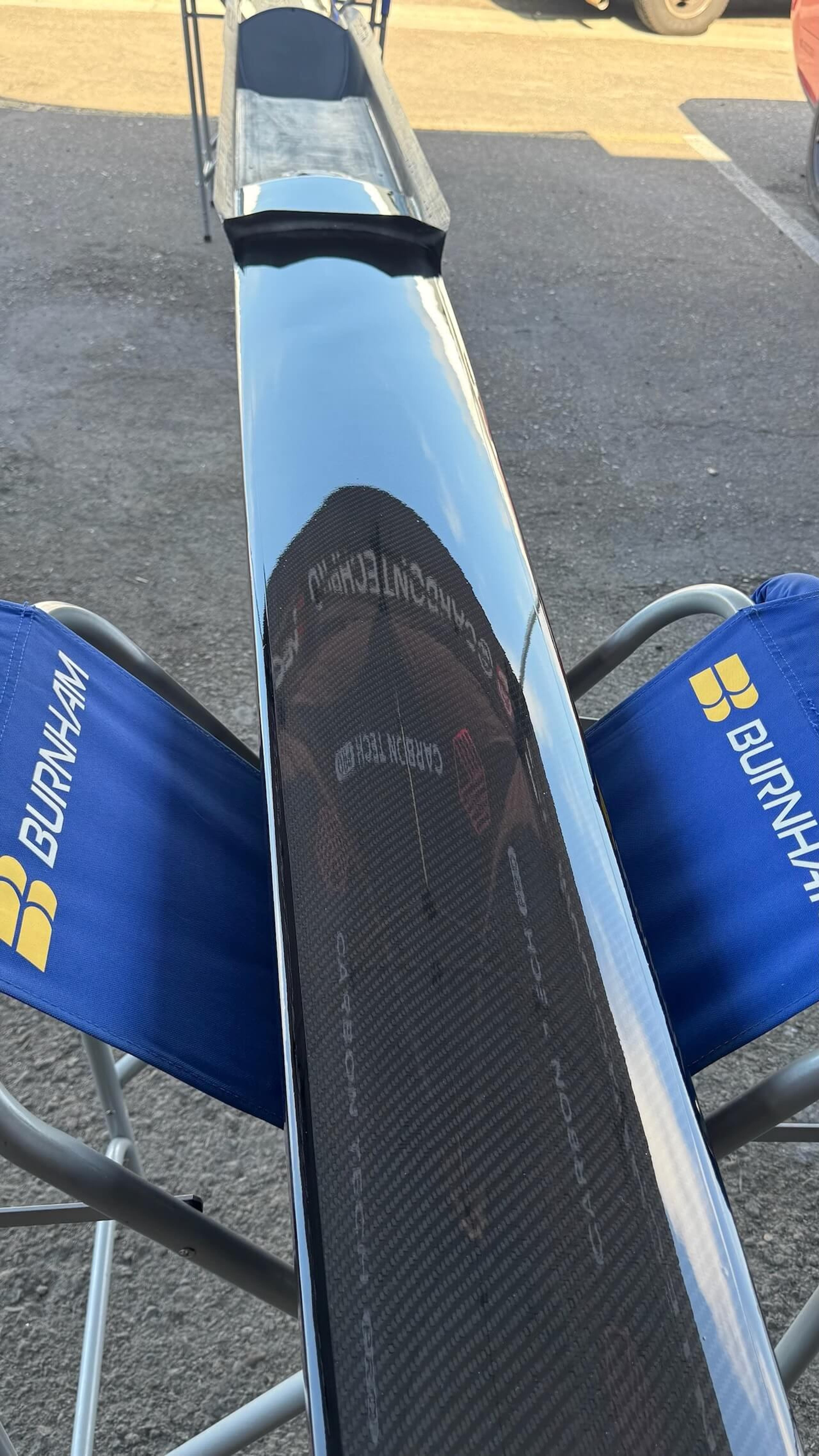 Close-up of repaired carbon fiber on a Fluidesign rowing shell before final finishing