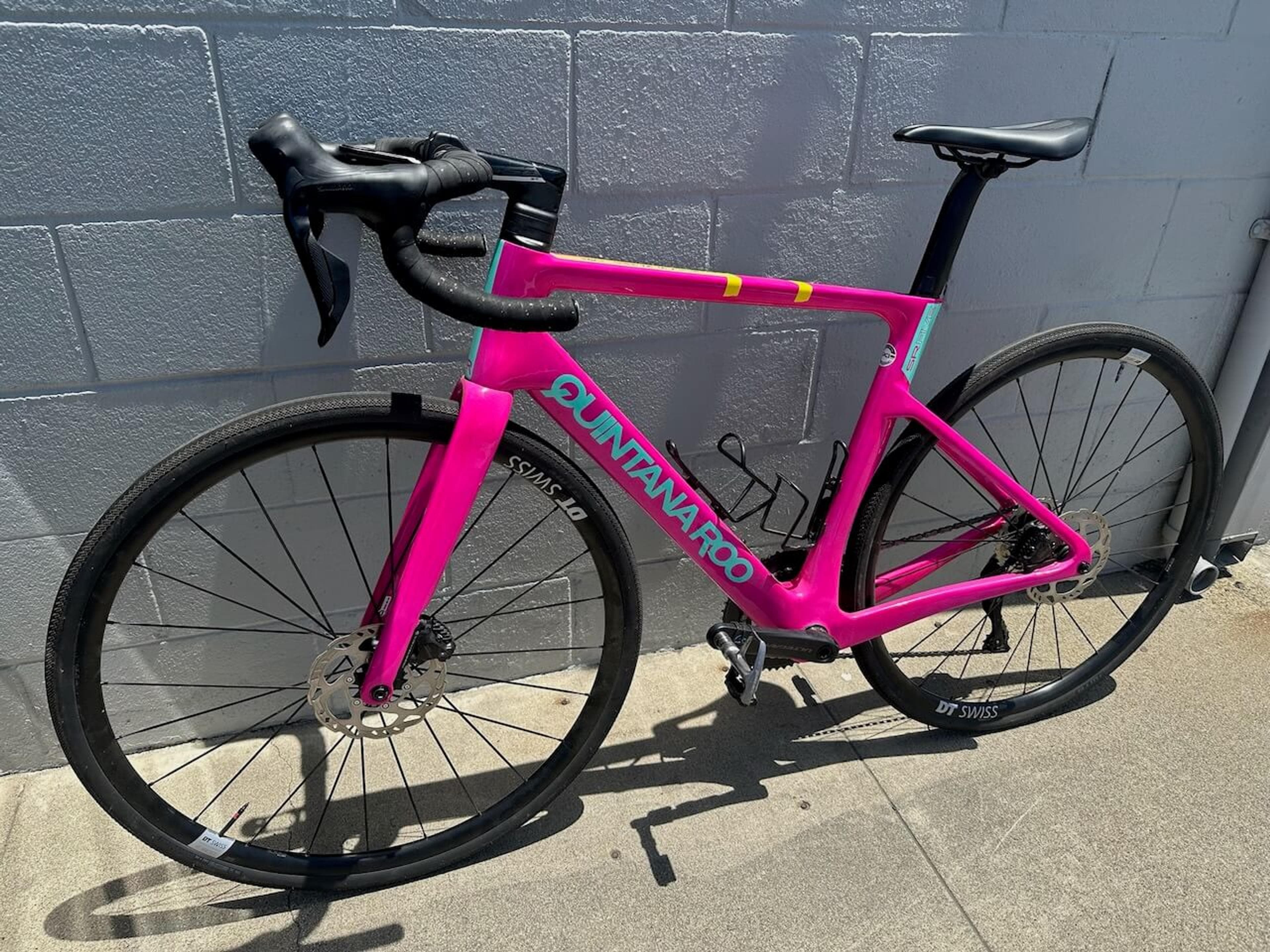 Pink Quintana Roo SRfive road bike before carbon fiber frame repair